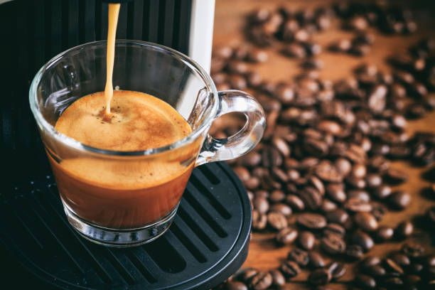Espresso coffee preparation on a wooden table