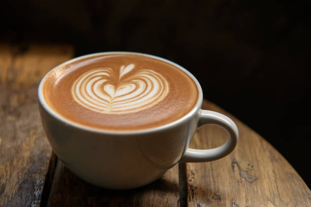 A cup of latte on wooden table